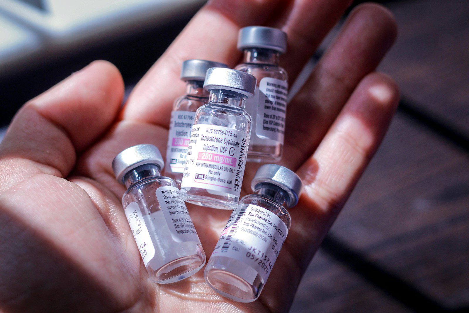 World Hepatitis Day 2025 five clear glass vial bottles