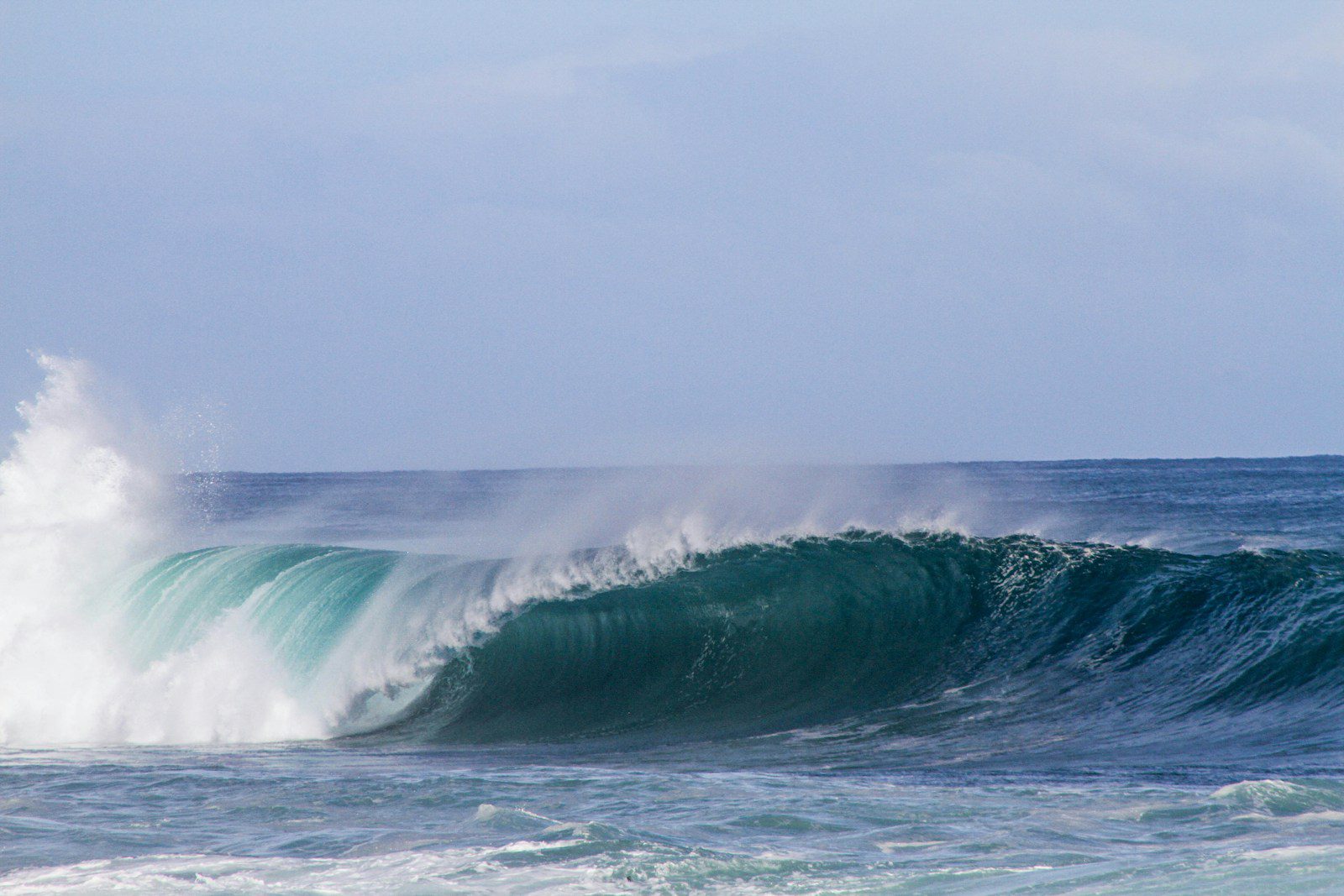 Waves Damaging sea wave under gray clouds at daytime